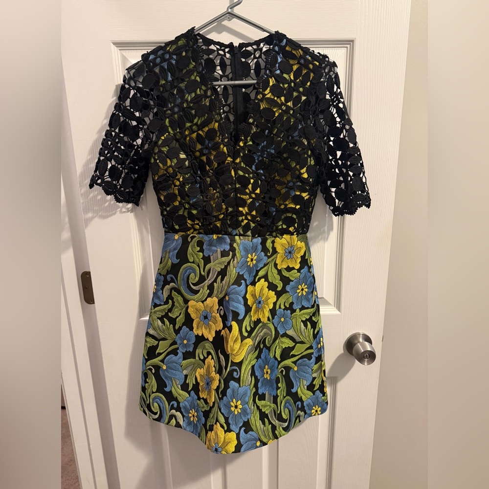 ASOS design mini dress with black lace top and green embroidered skirt